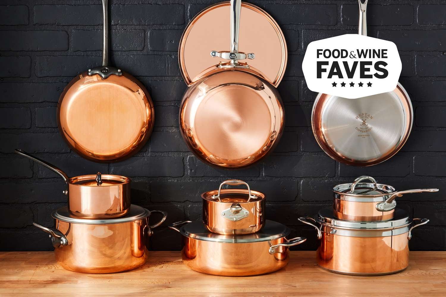 Different types of professional cookware including skillets, pots and Dutch ovens on a stovetop